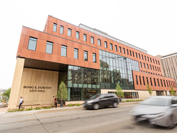The exterior facade of Levy Hall shown from street view.