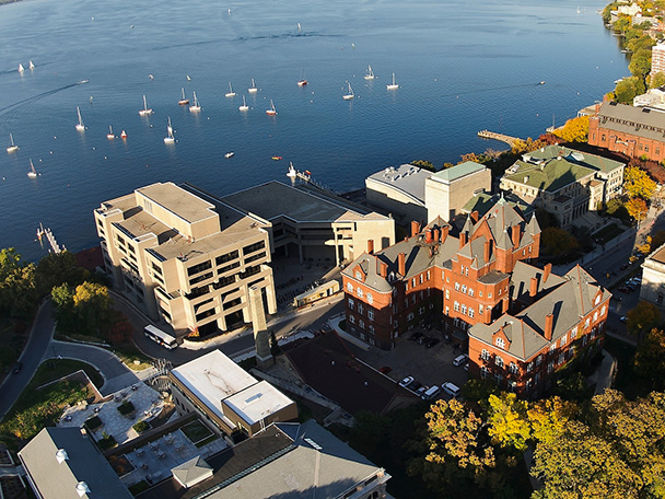 Aerial view looking northeast over campus buildings along the southern shore of Lake Mendota.